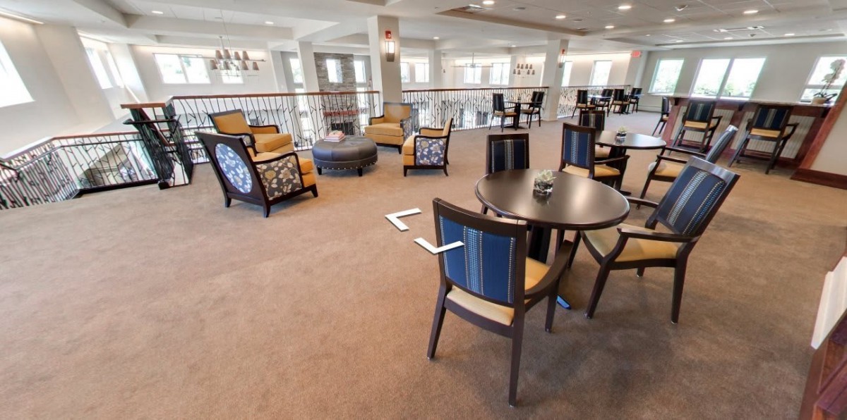A spacious lounge with comfortable seating and elegant interior design.