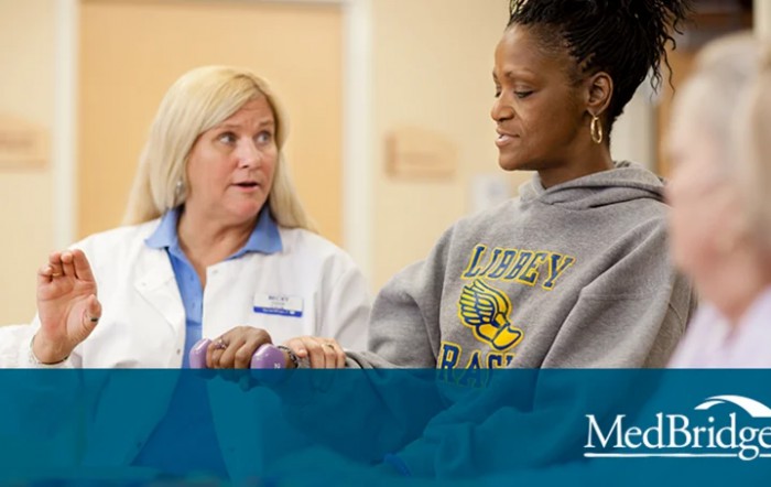 A healthcare professional assists a patient during a physical therapy session.