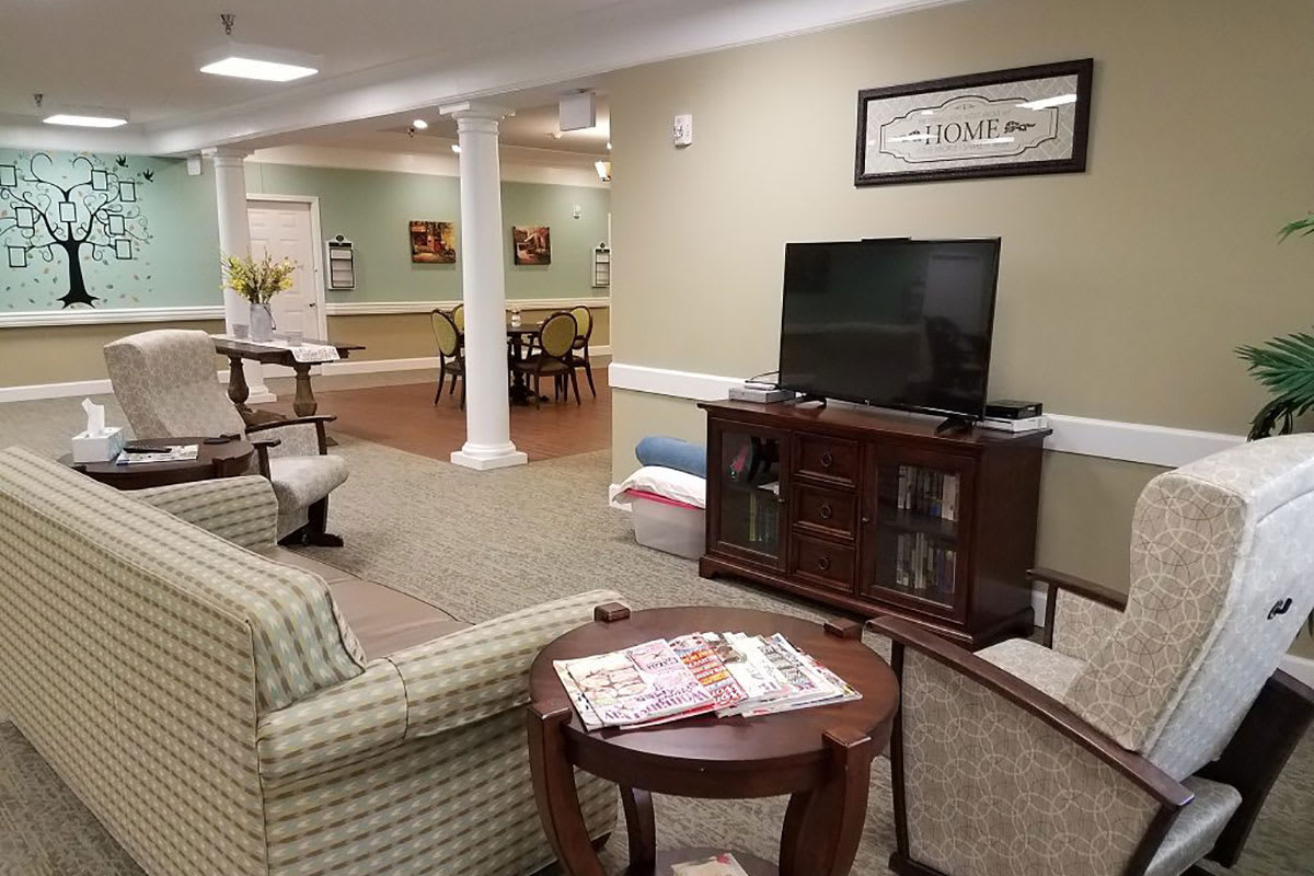A cozy living area with comfortable seating and a television.