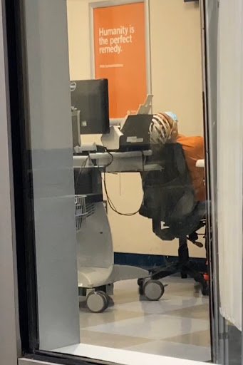 A glimpse into a modern office workspace featuring a computer desk and ergonomic chair.