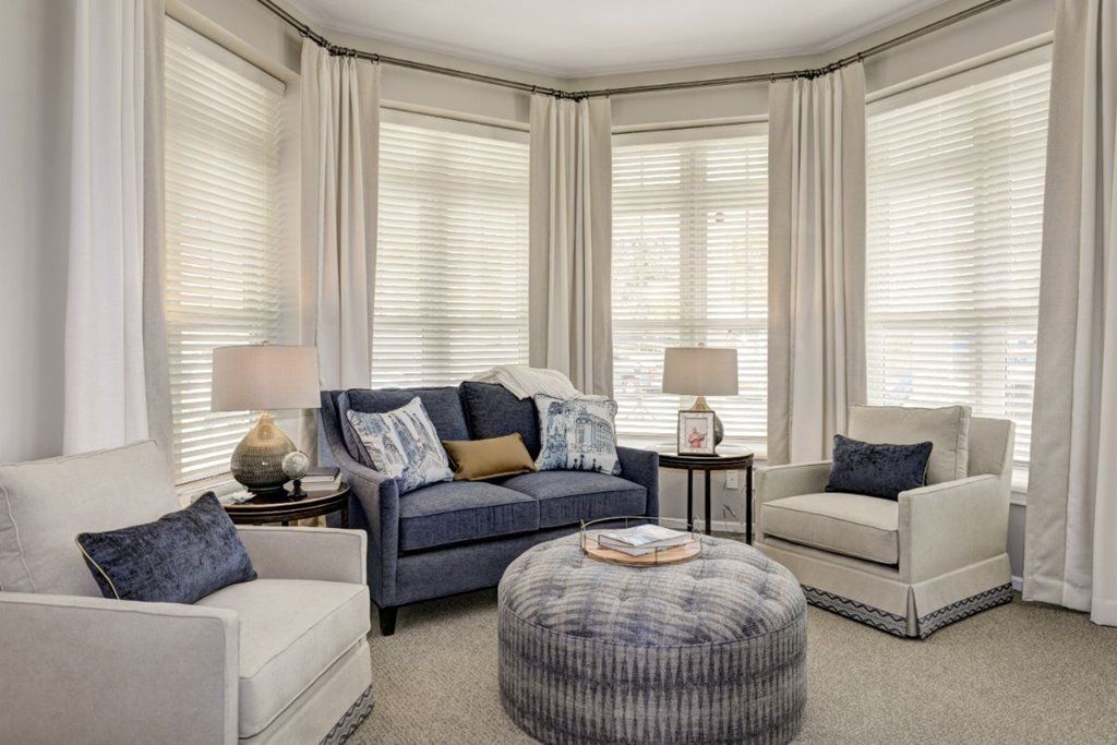 A cozy living room with comfortable seating and elegant decor.