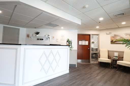 A modern reception area featuring sleek design and comfortable seating.