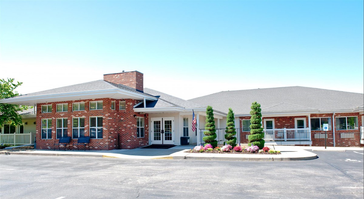 A modern brick building with well-maintained landscaping and a welcoming entrance.