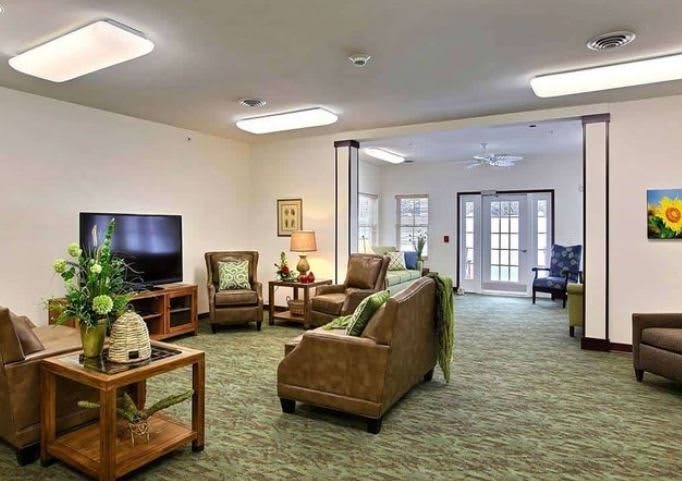 A cozy living room with comfortable seating and a television.