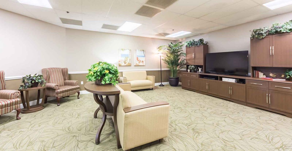A well-lit waiting room with comfortable seating and decorative elements.
