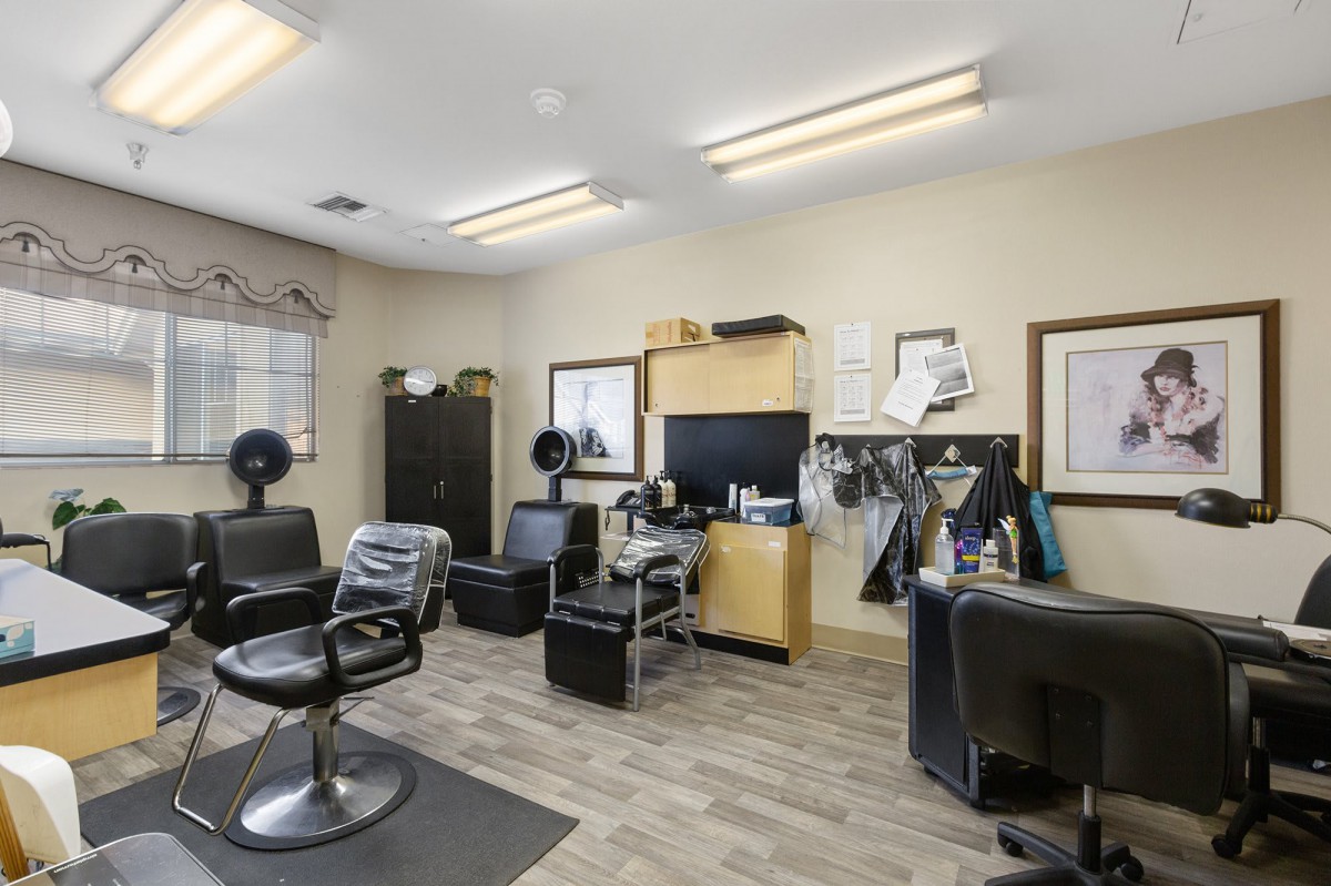 A well-equipped hair salon with chairs and styling stations.