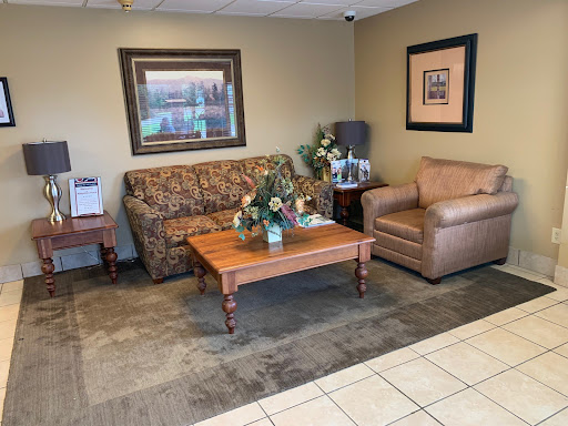 A cozy lobby area featuring comfortable seating and tasteful decor.