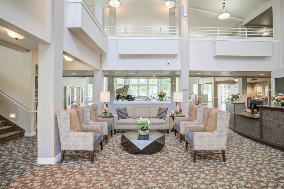 A modern and spacious lobby with comfortable seating arrangements and elegant decor.