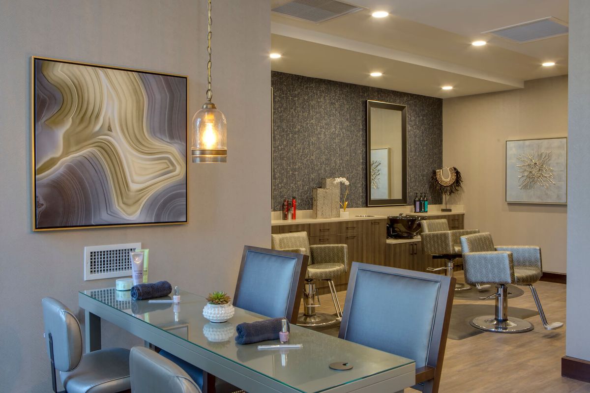 A modern dining area with stylish decor and lighting.