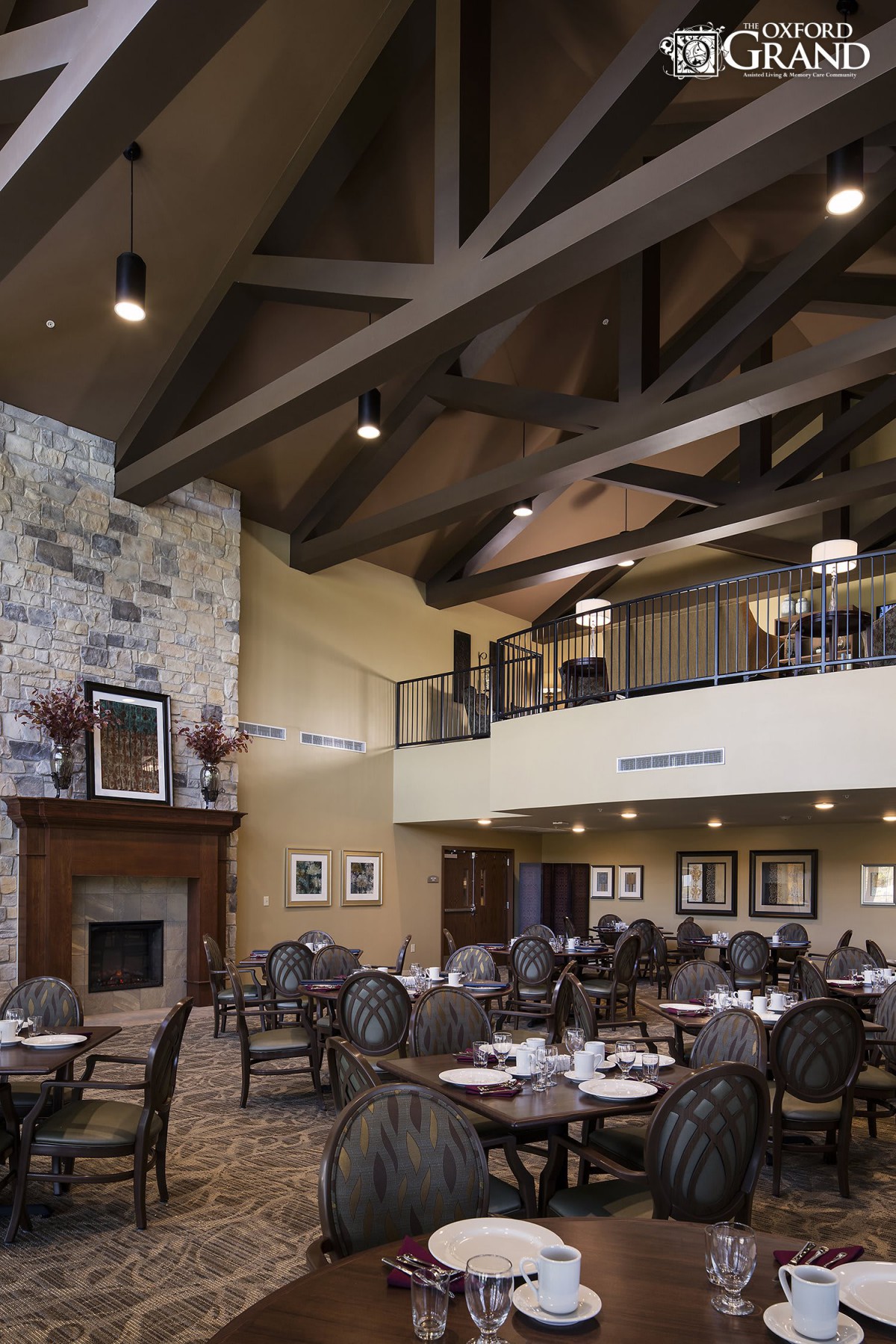 Spacious dining area with elegant decor and a cozy fireplace.