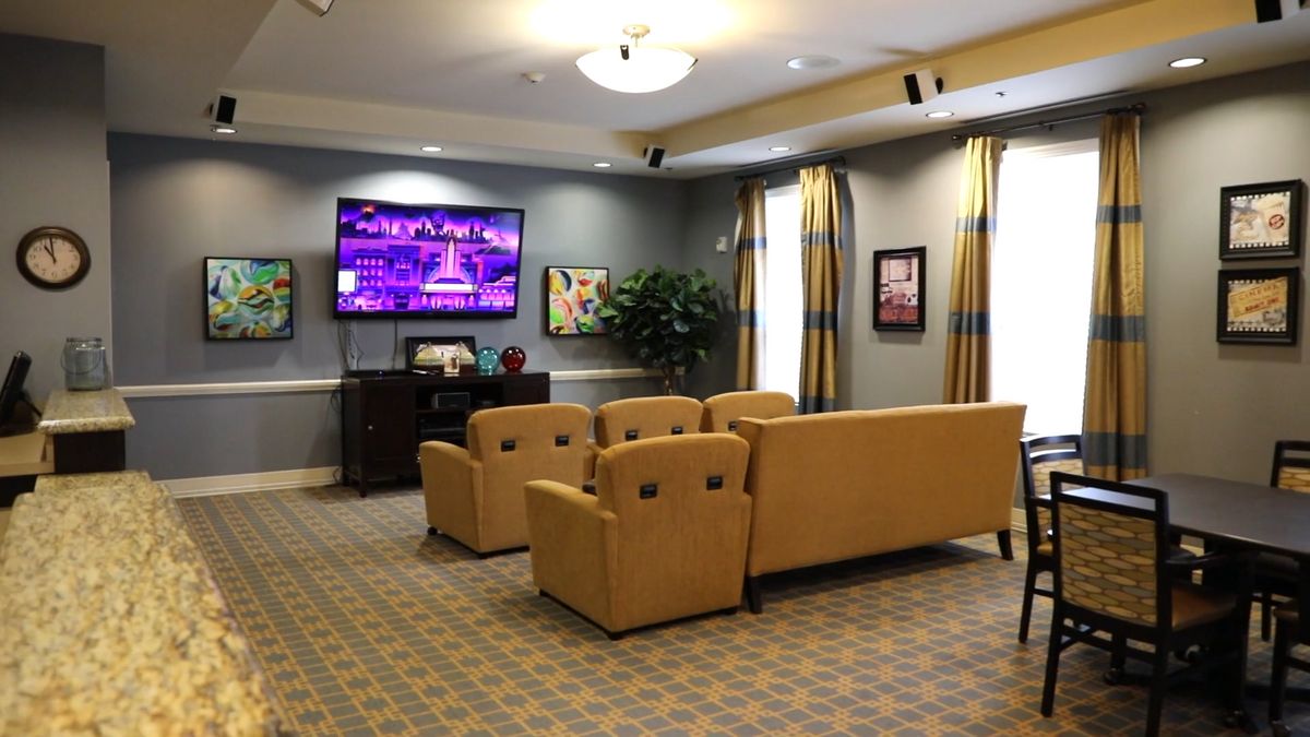 Cozy living room with comfortable seating and a large television.