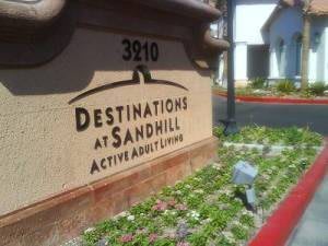 Entrance sign for Destinations at Sandhill, an active adult living community.
