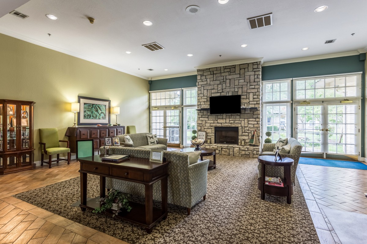 A cozy living room with a fireplace and comfortable seating.