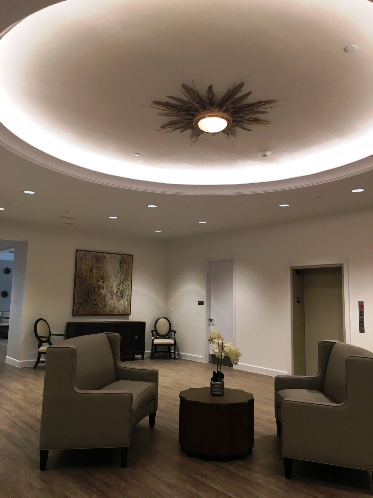 A modern lobby interior with comfortable seating and stylish lighting.