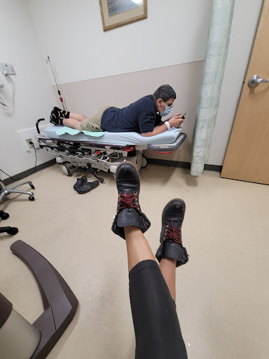 A moment in the emergency room, capturing a patient relaxing while waiting for medical attention.