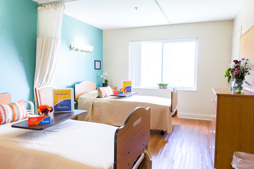 A bright and welcoming patient room in a healthcare facility.