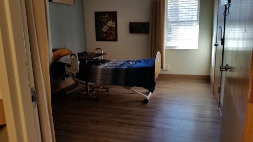 A quiet hospital room featuring a hospital bed and minimal decor.
