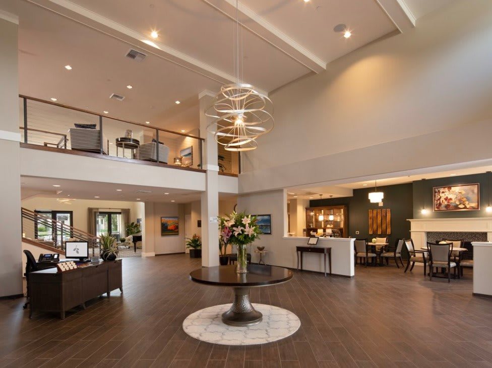 A modern and spacious lobby with stylish lighting and comfortable seating.
