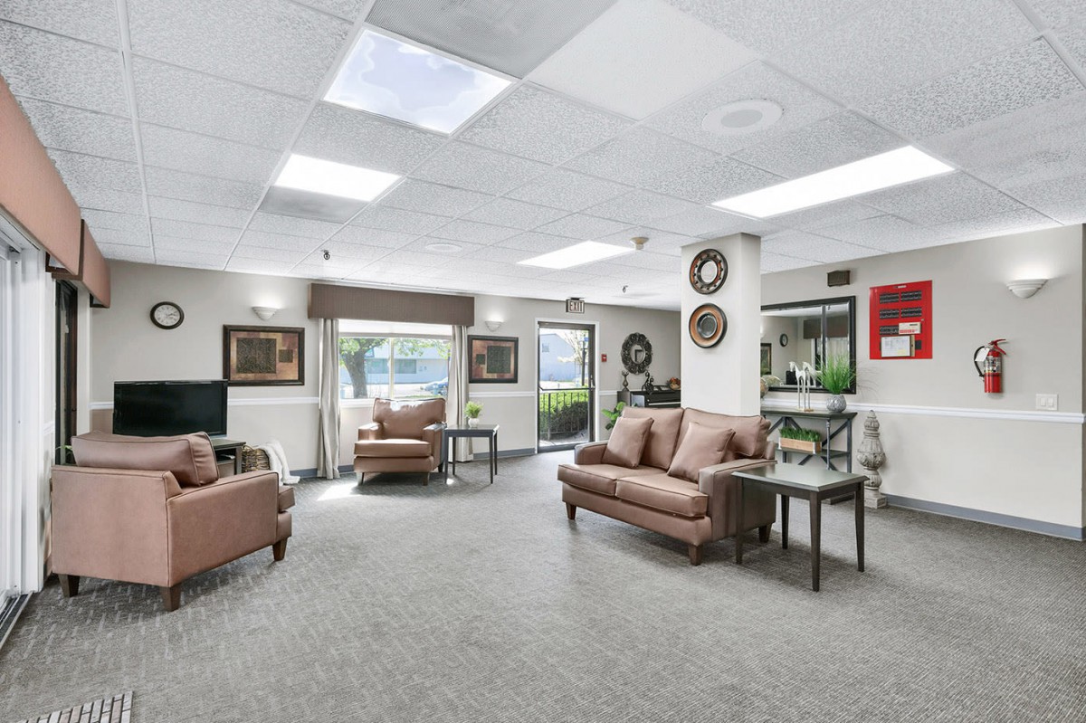 A spacious lobby with comfortable seating and decorative elements.