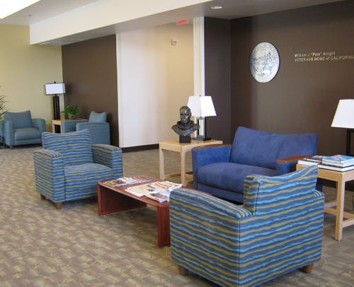 A well-furnished waiting area with comfortable seating and modern decor.
