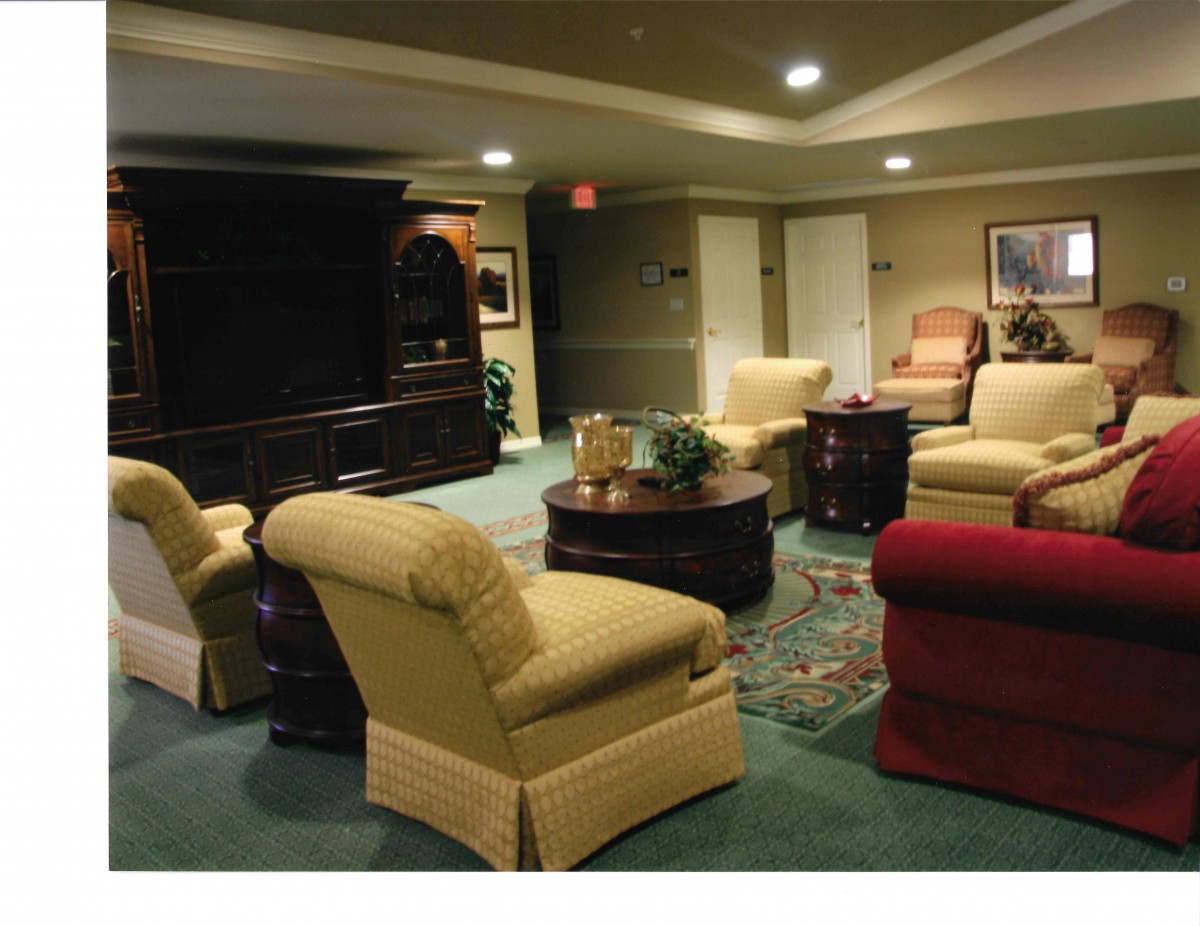 A cozy living room featuring comfortable seating and a central coffee table.