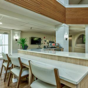 Modern dining area with wooden accents and contemporary decor.