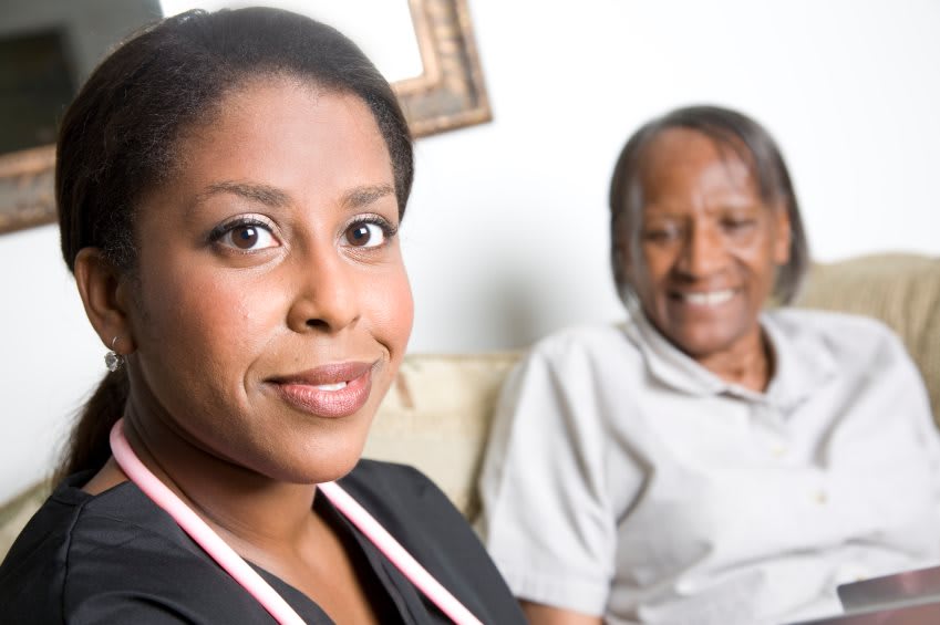 A healthcare professional with a patient, showcasing caregiving and support.