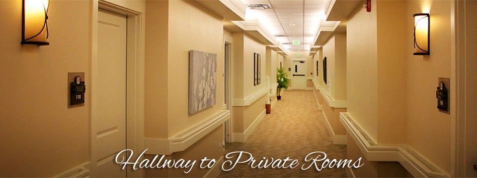 A well-lit hallway leading to private rooms.
