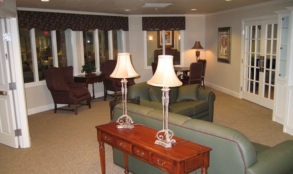 A cozy living room with elegant lamps and comfortable seating.