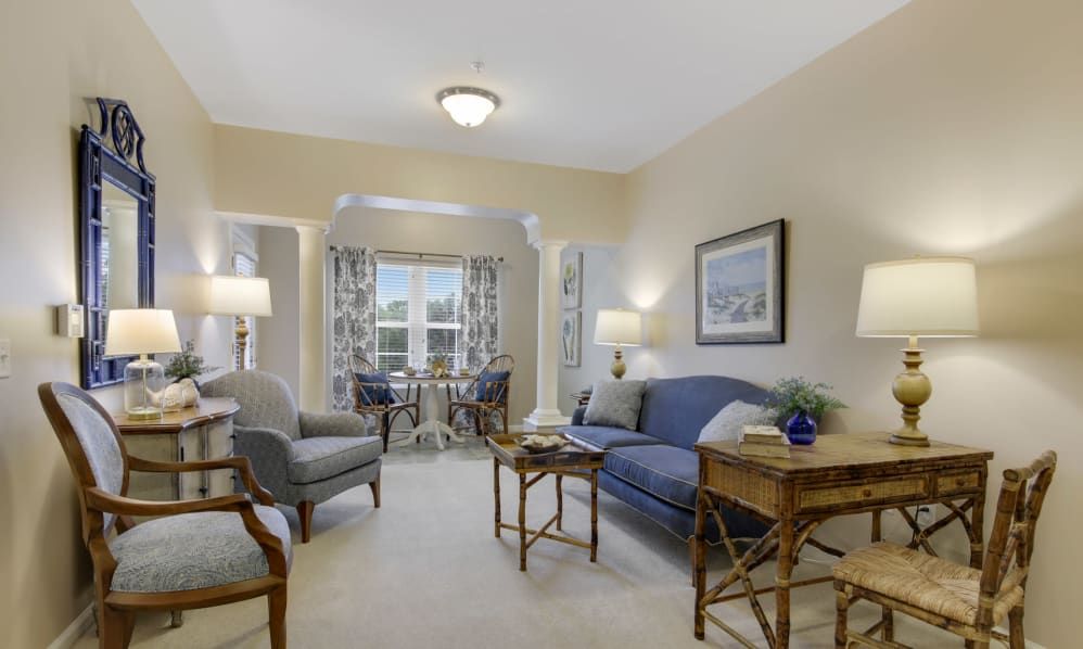 A cozy living room with comfortable furniture and warm lighting.