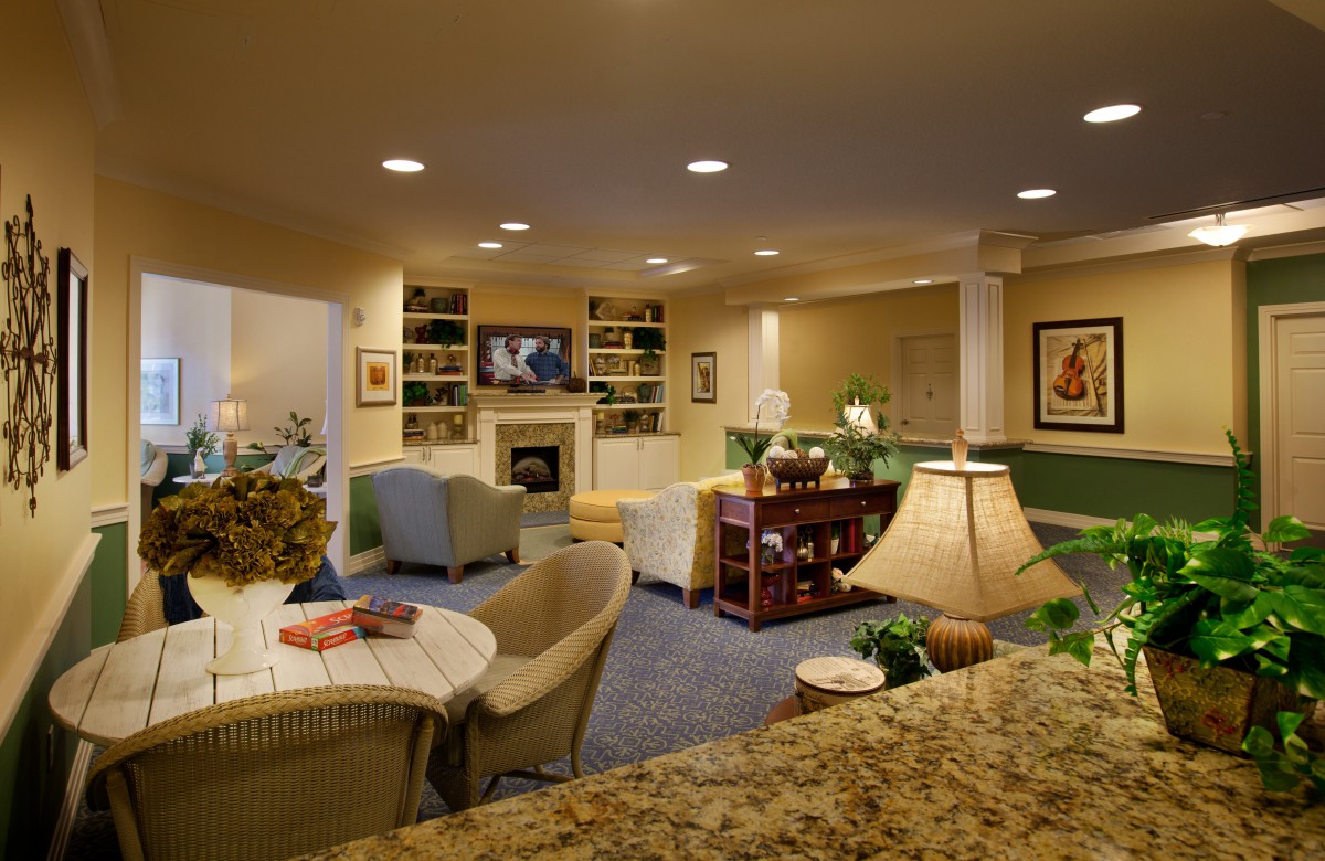 Cozy living room with a fireplace and comfortable seating arrangement.