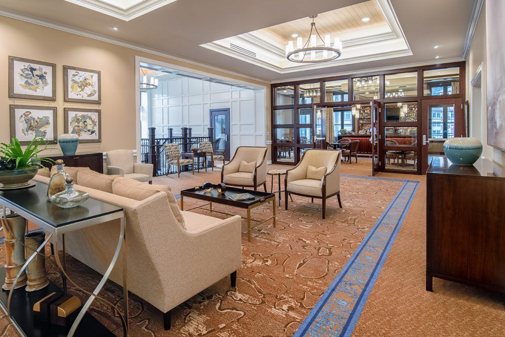 A modern and luxurious hotel lobby with comfortable seating arrangements and elegant lighting.