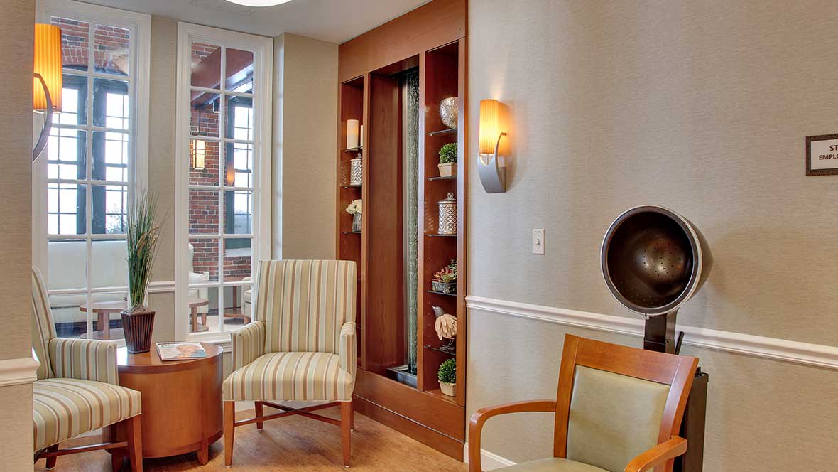 A modern waiting room with comfortable chairs and stylish decor.