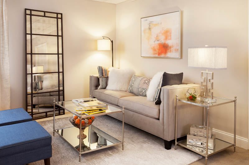 A cozy and modern living room with a neutral palette and stylish furnishings.