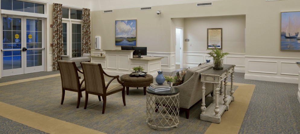 A cozy living room interior with comfortable seating and elegant decor.