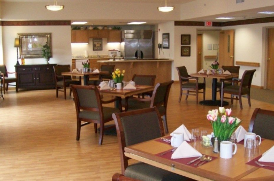 An empty dining area with neatly set tables and chairs.