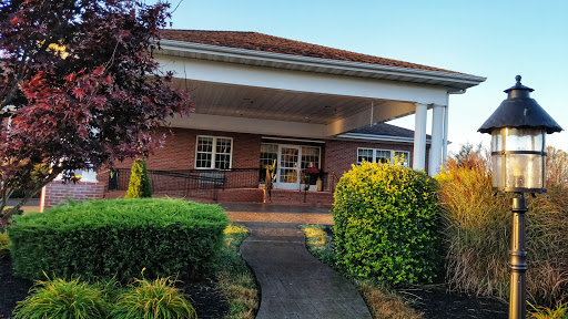 A welcoming front entrance surrounded by well-maintained landscaping.