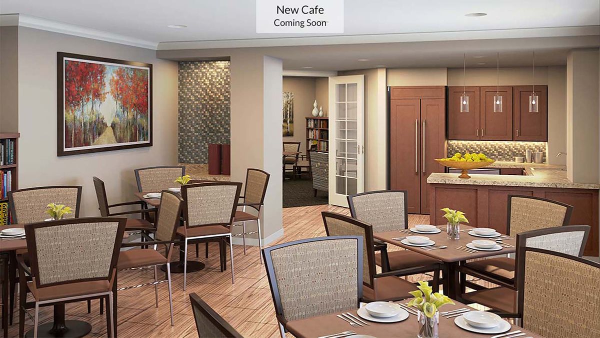 A modern cafe interior featuring tables and chairs, with a 'New Cafe Coming Soon' sign.