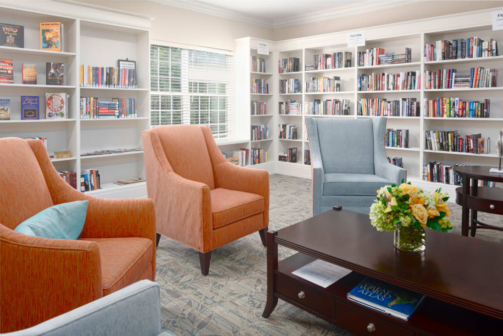 A cozy library with comfortable seating and well-organized bookshelves.