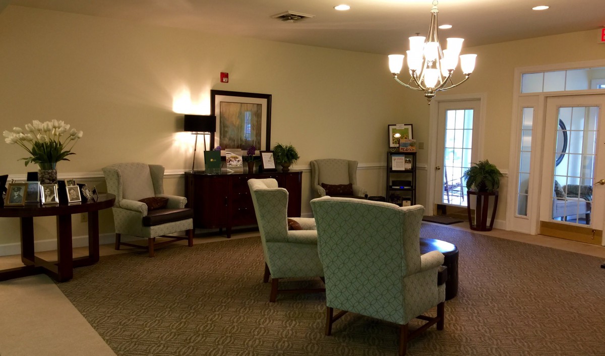 A cozy lounge area with comfortable chairs and warm lighting.