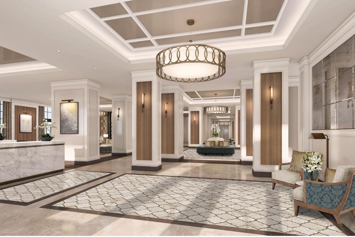 A luxurious hotel lobby with elegant chandeliers and modern design.