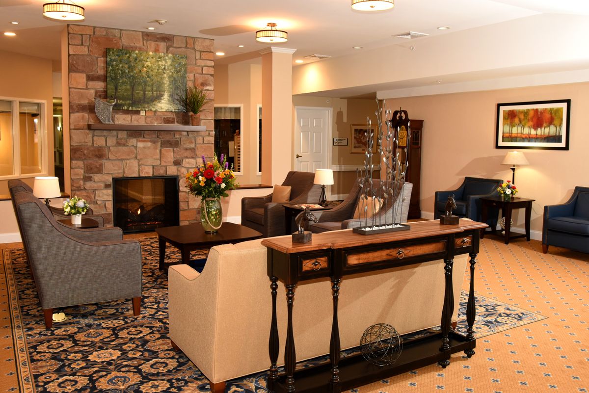 A cozy living room with a warm fireplace and stylish furniture.