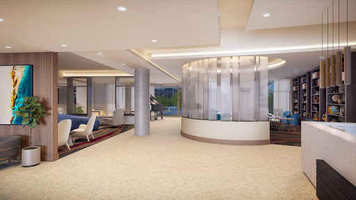 A modern lobby featuring elegant furniture and a spacious design.