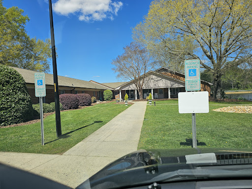 A clear day showcasing a well-maintained building with accessible parking spaces.