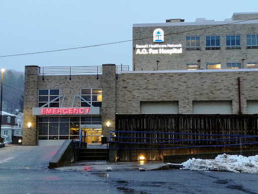 The entrance of A.C. Pru Hospital showcasing the emergency services sign.
