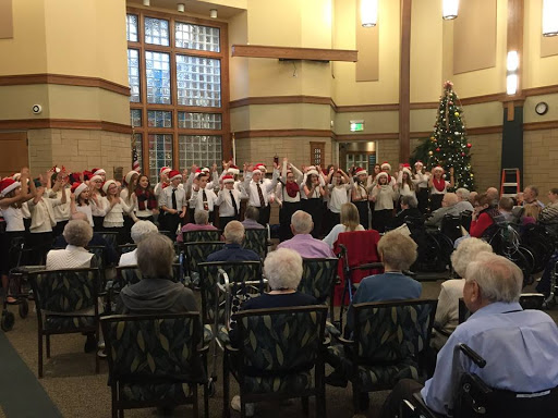 A festive choir performance for seniors during the holiday season.
