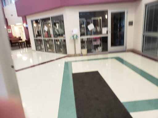 Interior view of a shopping center showcasing the entrance and floor design.