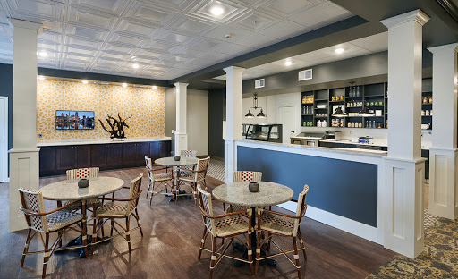 A modern caf interior featuring stylish furniture and a welcoming bar area.