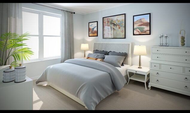 A serene bedroom decorated with neutral tones and modern artwork.