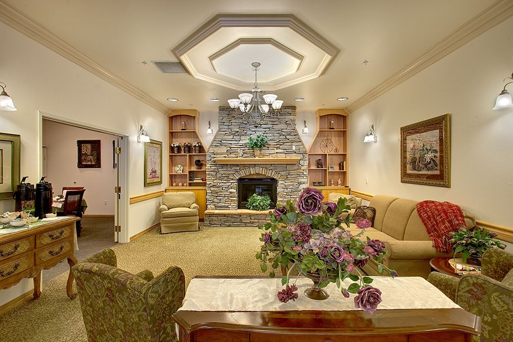 A cozy living room with a fireplace and elegant decor.